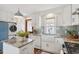 Bright kitchen featuring stainless appliances, granite countertops, a farmhouse sink, and a stylish backsplash at 3278 S Lafayette St, Englewood, CO 80113