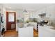 Well-lit kitchen features stainless steel appliances, granite countertops, an island, and a stylish backsplash at 3278 S Lafayette St, Englewood, CO 80113