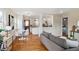 Open-concept living area boasts hardwood floors, a dining area, and seamless access to the kitchen at 3278 S Lafayette St, Englewood, CO 80113