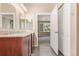 Bathroom with double vanity, and access to bedroom at 8427 S Hoyt Way # 107, Littleton, CO 80128