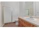 Well-lit bathroom featuring a glass shower and a wood vanity at 8427 S Hoyt Way # 107, Littleton, CO 80128