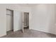 Bright bedroom featuring neutral carpet, closet, and white walls at 8427 S Hoyt Way # 107, Littleton, CO 80128