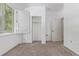 Bedroom featuring neutral carpet, white walls, bright window with shutters, and closet at 8427 S Hoyt Way # 107, Littleton, CO 80128