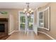 Bright dining area featuring tile floors and plantation shutters at 8427 S Hoyt Way # 107, Littleton, CO 80128