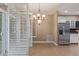Bright dining area featuring stainless steel appliances and tile flooring at 8427 S Hoyt Way # 107, Littleton, CO 80128