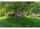 Lush lawn and mature trees create a serene setting at 8427 S Hoyt Way # 107, Littleton, CO 80128