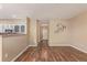 Spacious living room with hardwood floors leading to the kitchen area at 8427 S Hoyt Way # 107, Littleton, CO 80128