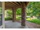Covered outdoor patio featuring stone columns and a pebble ground cover at 8427 S Hoyt Way # 107, Littleton, CO 80128
