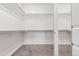 Spacious walk-in closet with ample shelving and rod space for organized storage at 8427 S Hoyt Way # 107, Littleton, CO 80128