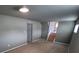Carpeted basement featuring ample space and adjacent stairwell access at 902 S Potomac Way, Aurora, CO 80012