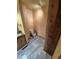 Small bathroom featuring a toilet and vanity with marble-like tiling at 902 S Potomac Way, Aurora, CO 80012