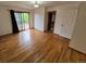 Spacious bedroom featuring hardwood floors and a glass sliding door to balcony at 902 S Potomac Way, Aurora, CO 80012