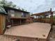 Large wooden deck perfect for outdoor entertaining, with a pergola and metal railing at 902 S Potomac Way, Aurora, CO 80012
