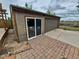 Detached garage with modern sliding door and ample parking space at 902 S Potomac Way, Aurora, CO 80012
