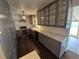 Beautiful kitchen featuring modern cabinetry, stainless appliances, and a stylish range hood at 902 S Potomac Way, Aurora, CO 80012