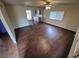 Open-concept living room featuring hardwood floors and large windows at 902 S Potomac Way, Aurora, CO 80012
