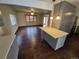 Bright living space with hardwood floors flowing into the open kitchen area at 902 S Potomac Way, Aurora, CO 80012
