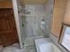 Modern shower with glass doors and tile surround next to a bathtub at 902 S Potomac Way, Aurora, CO 80012