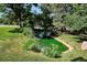 Backyard featuring a tranquil pond surrounded by lush landscaping, creating a serene outdoor oasis at 4675 S Yosemite St # 205, Denver, CO 80237