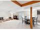 The finished basement features exposed beams, a drop ceiling, and lots of open space at 4675 S Yosemite St # 205, Denver, CO 80237