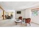 The spacious basement includes a living room and dining room with an adjacent window that provides natural light at 4675 S Yosemite St # 205, Denver, CO 80237