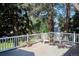Inviting outdoor deck with chairs and potted plants offers a relaxing space to enjoy the natural surroundings at 4675 S Yosemite St # 205, Denver, CO 80237