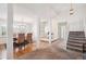 Wide angle shot of a foyer which leads into a dining room and stairway to the second floor at 4675 S Yosemite St # 205, Denver, CO 80237