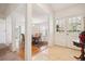 Bright foyer with hardwood floors transitions to a dining area with an adjacent living space at 4675 S Yosemite St # 205, Denver, CO 80237