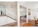 Inviting foyer with staircase, leading to a bright living space with large windows and neutral tones at 4675 S Yosemite St # 205, Denver, CO 80237