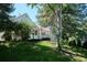 Quaint exterior with a manicured lawn and mature trees that enhance its natural beauty at 4675 S Yosemite St # 205, Denver, CO 80237