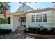 Inviting home exterior with charming black shutters and a beautifully landscaped front yard at 4675 S Yosemite St # 205, Denver, CO 80237