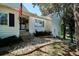 A welcoming exterior featuring stone landscaping, neat shrubbery, and a charming American flag at 4675 S Yosemite St # 205, Denver, CO 80237