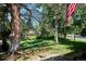 An idyllic front yard scene featuring lush greenery, mature trees, and a glimpse of neighborhood charm at 4675 S Yosemite St # 205, Denver, CO 80237