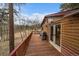 A portion of the deck featuring a gas grill and access to the home at 27888 Richmond Hill Rd, Conifer, CO 80433
