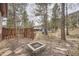 Backyard with stone patio and fire pit at 31168 Witteman Rd, Conifer, CO 80433