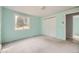 Light and bright bedroom with a large window and closet at 31168 Witteman Rd, Conifer, CO 80433