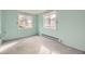 Bedroom with wall to wall carpet and a pair of windows at 31168 Witteman Rd, Conifer, CO 80433