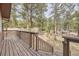 View of the wooden deck and surrounding woods at 31168 Witteman Rd, Conifer, CO 80433