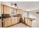 A kitchen featuring light wood cabinets, an undermount sink, wood countertops, and stainless steel appliances at 31168 Witteman Rd, Conifer, CO 80433