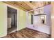 Bright room with mirror wall and wood plank flooring at 31168 Witteman Rd, Conifer, CO 80433