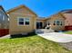 Backyard view featuring a well-maintained lawn and concrete patio at 425 W 128Th Dr, Westminster, CO 80234