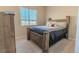 Cozy bedroom with a wooden bed frame and neutral decor at 425 W 128Th Dr, Westminster, CO 80234