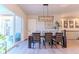 Bright dining room features a table with chairs and access to a patio at 425 W 128Th Dr, Westminster, CO 80234