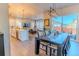 Open concept dining room with dark wood table and access to backyard at 425 W 128Th Dr, Westminster, CO 80234