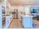 Spacious kitchen with stainless steel appliances, large center island, and open view to the living area at 425 W 128Th Dr, Westminster, CO 80234