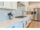 Well-equipped kitchen featuring stainless steel appliances, a gas cooktop, and ample counter space at 425 W 128Th Dr, Westminster, CO 80234