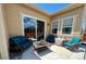 Outdoor patio seating featuring wicker furniture with blue cushions at 425 W 128Th Dr, Westminster, CO 80234