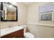 Clean bathroom with single sink vanity, toilet and shower at 4492 Fairplay Way, Denver, CO 80239