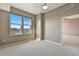 Neutral bedroom with carpet and bright windows looking out onto the city at 7931 W 55Th Ave # 105, Arvada, CO 80002
