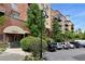 Attractive exterior of the building showcasing well-maintained grounds, parking, and unique architectural elements at 7931 W 55Th Ave # 105, Arvada, CO 80002